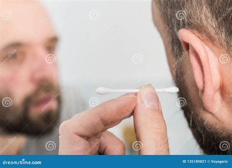 Man Removing Wax From Ear Using Q Tip Stock Image Image Of Swab Buds