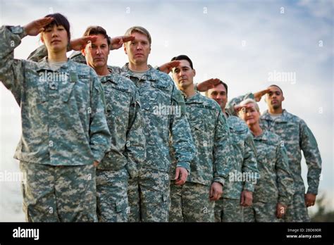 Portrait Of A Line Of Us Army Soldiers Saluting Stock Photo Alamy