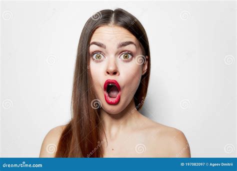 Woman With Surprised Facial Expression Wide Open Mouth Bared Shoulders Long Hair Stock Image