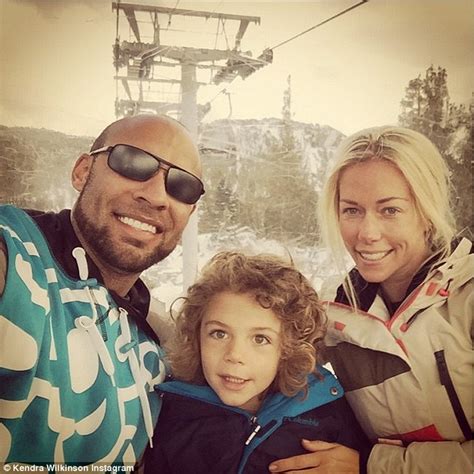 kendra wilkinson and husband hank baskett pose for a selfie during ski trip with their son