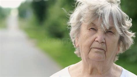 Portrait Of Serious Old Woman Aged 80s Outdoors Stock Footage Video