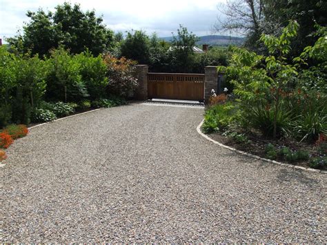Design ideas for a small classic courtyard driveway full sun garden for summer in sussex with natural stone paving. Driveways Specialists | Serenity Landscaping Kent