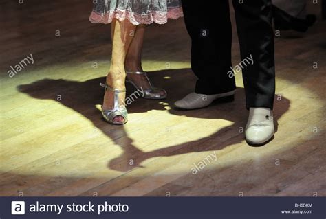 Older Couple At A Tea Dance Ballroom Dance Floor Shadow Of Man And