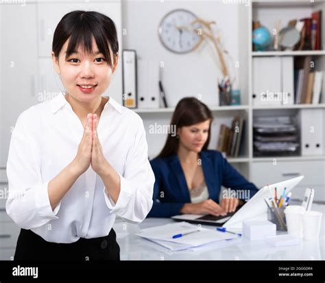 Young Successful Chinese Business Woman In Traditional Chinese Greeting