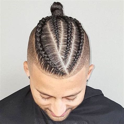 Braids best suit the men with long hair and are quick and versatile options to try out. Best Fade Haircut Combination With Braided Bun For Men