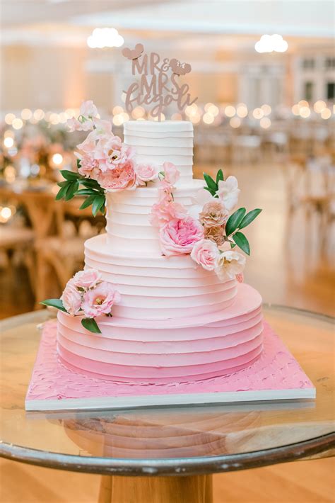 elegant pink wedding cake with pink flowers photo susan elizabeth photography florist