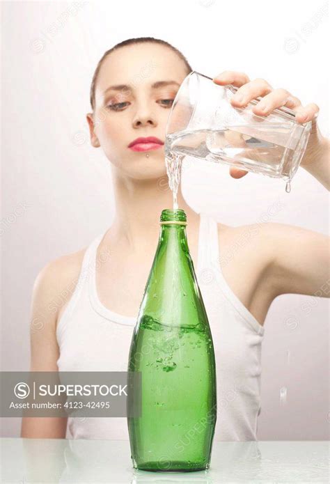 Woman Pouring Water Superstock