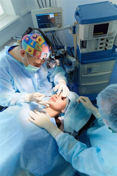 Team Surgeon At Work In Operating Room Stock Photo Image Of Coat