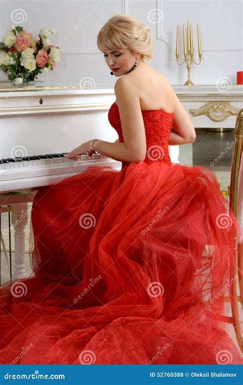 Woman In A Red Dress Playing On A Piano Stock Photo Image Of Elegance