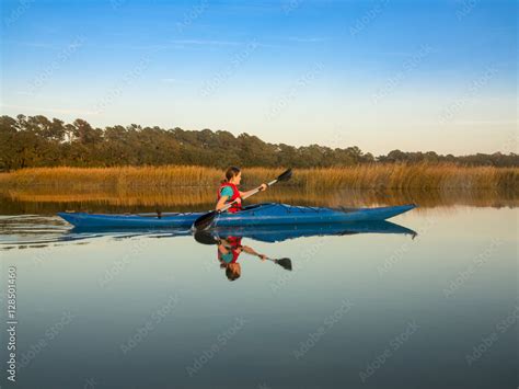 Teen Kayaking Through Glassy Water Stock Foto Adobe Stock