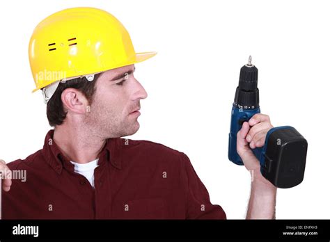 Man Holding Drill Stock Photo Alamy