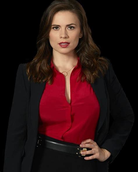 A Woman In A Red Shirt And Black Blazer Standing With Her Hands On Her Hips