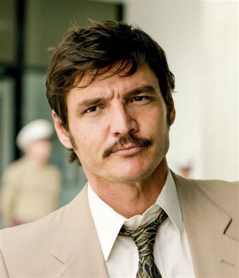 A Man Wearing A Suit And Tie With A Moustache On His Face Is Looking At The Camera