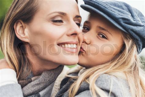 Daughter Kissing Her Mother Stock Image Colourbox