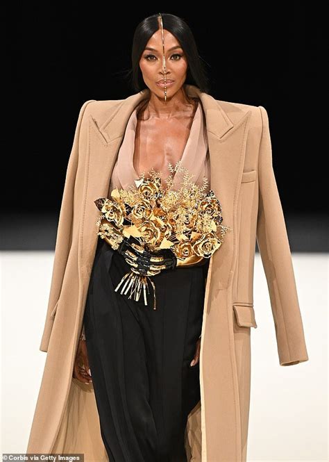 Naomi Campbell Cuts A Very Quirky Figure With Unique Headpiece And