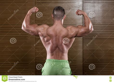 Muscular Man Flexing Back Muscles Pose Stock Image Image Of Confident