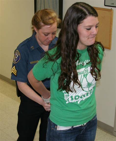 Young Woman Gets Her Hands Cuffed Behind Back At Police Open Day Women Handcuffs Handcuff