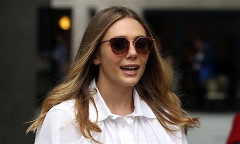 Elizabeth Olsen Shows Off Her Lithe Legs In Tapered Trousers