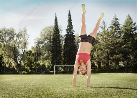 Woman Doing Cartwheel In Park Stock Image F Science Photo Library