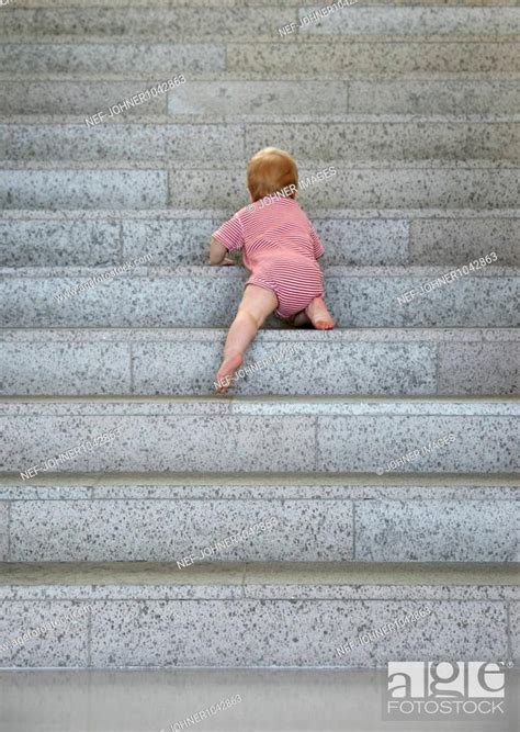 Baby Climbing Up Stairs Stock Photo Picture And Royalty Free Image