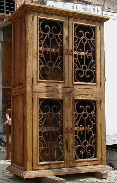 Check out our kitchen cabinets selection for the very best in unique or custom, handmade pieces from our cabinets & food storage shops. The Espanola Armoire features naturally distressed wormwood and hand-forged weathered iron ...