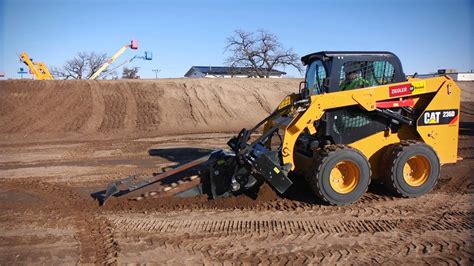 Use both hands on the trencher's handles to guide it. Cat® Trencher Attachment - YouTube