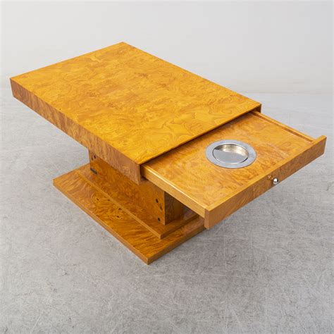 Charles jacobs glass and solid oak leg coffee / side table. A Grange coffee table, late 20th century. - Bukowskis
