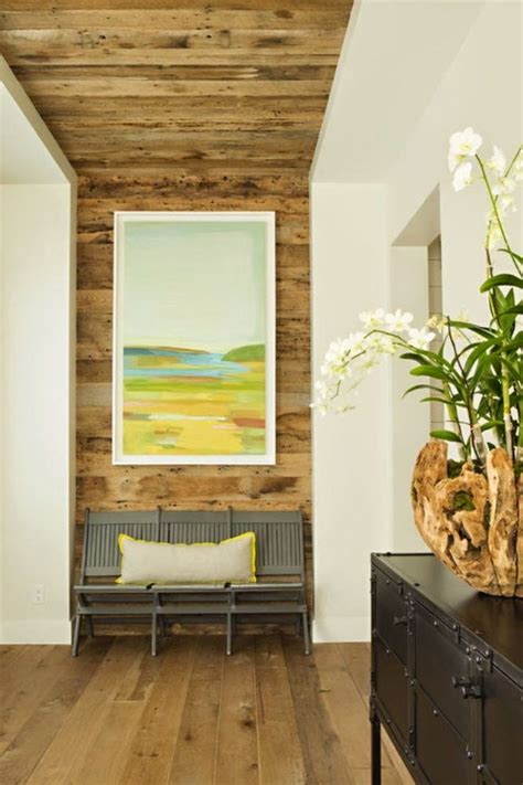If your room has a fireplace, that's the perfect place to start. the focal point of the front entry is this continuous wood wall that flows into the ceiling ...