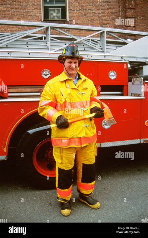 Fireman In Front Of Fire Truck Stock Photo Alamy