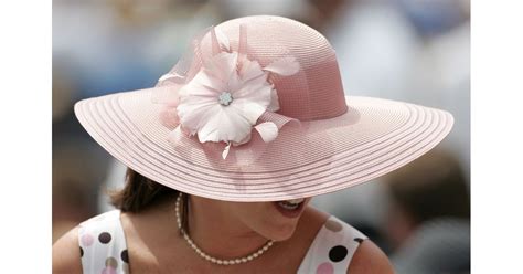 A Spectator Was Seen In The Grandstand Wearing Her Light Pink Hat In