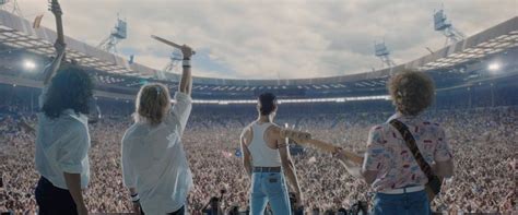 Queen at wembley stadium, 1986. A CGI crowd at Wembley Stadium Gazes back at the members ...