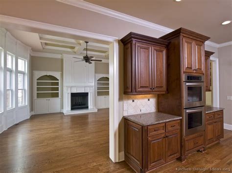 The cabinetry chooses the white and brown cupboards and the drawers. Kitchens With Dark Wood Floors | ... of Kitchens - Traditional - Two-Tone Kitchen Cabinets ...