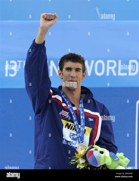 us swimmer michael phelps cheers during the award ceremony after winning the mens 200m