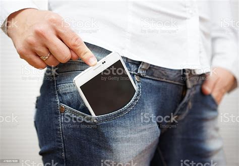 Woman Pushing Big Mobile Phone In Jeans Pocket Stock Photo Download