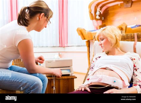 Midwife Seeing Mother For Pregnancy Examination Stock Photo Alamy