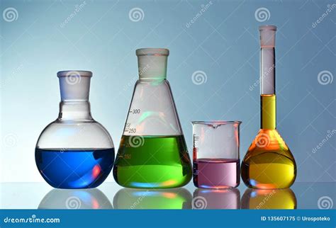 Laboratory Glassware With Colorful Liquids On Blue Background Stock Image Image Of Flask