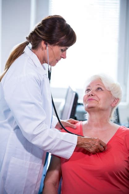 Female Doctor Examining A Patient Photo Free Download