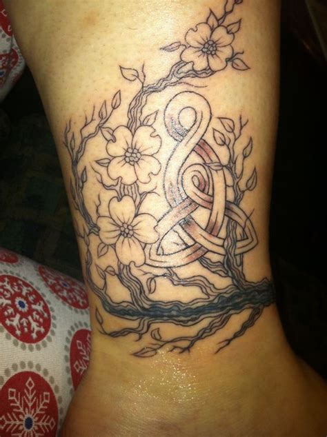 My baby boy died of hydrocephalus at 8 days old. My tattoo. Symbol for mother and child with dogwood to ...