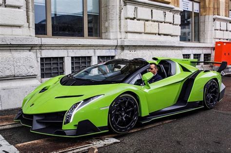 A Green Sports Car Parked On The Side Of The Road In Front Of A Building