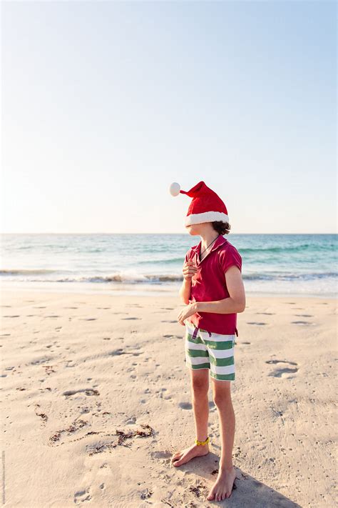 Child Playing At The Beach At Christmas Time In Australia By Stocksy