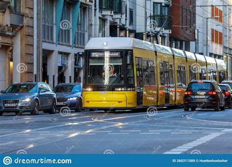 Yellow Tram Drives Along A Street The Berlin Tramway German