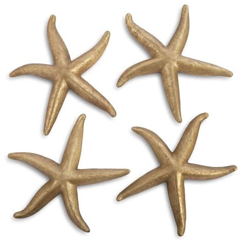 Four Gold Starfishs On A White Background
