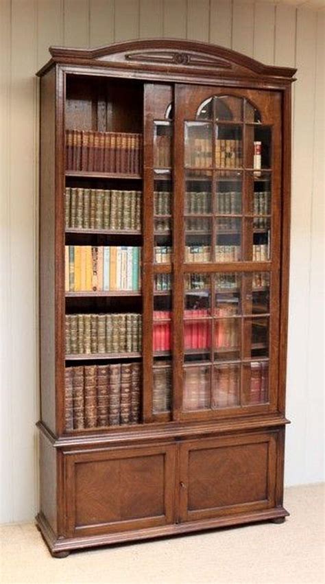 Bookcases certainly aren't only for books! Solid Oak Glazed Bookcase For Sale at 1stdibs