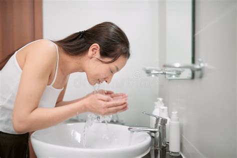 Beautiful Asian Woman Is Washing Her Face Stock Image Image Of Home