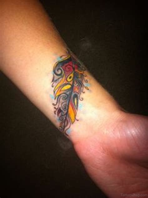 The wrist is a popular location for tattoos—and for good reason. 31 Awesome Peacock Feather Tattoos On Wrist