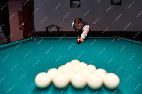 Premium Photo Man Holding Arm On Billiard Table Playing Snooker Game Or Preparing Aiming To
