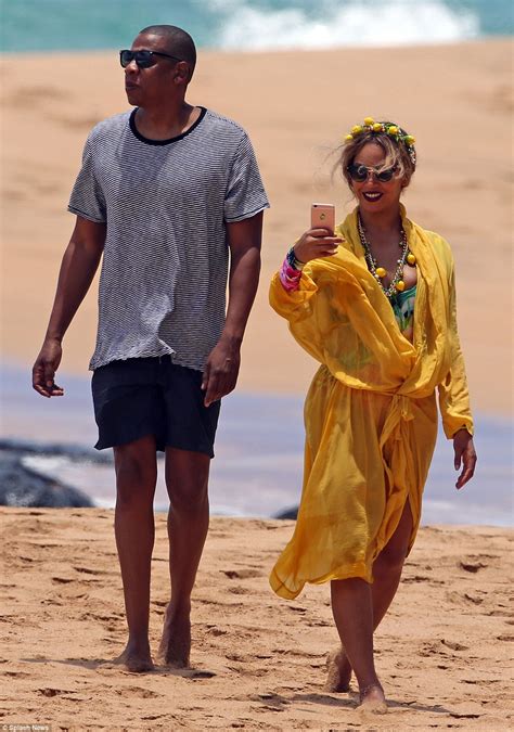 beyonce slays in colourful one piece swimsuit as she shows pda with jay z in hawaii daily mail