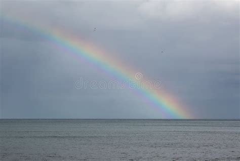 Rainbow Over The Sea Stock Photo Image Of Outdoor Cloud 76627710