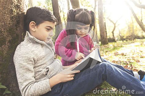 Kids Reading Book Outdoors Stock Photo Image Of Childhood 80381722