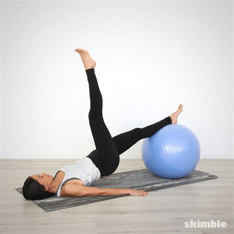 Bridge With Leg Lifts On Ball Exercise How To Workout Trainer By